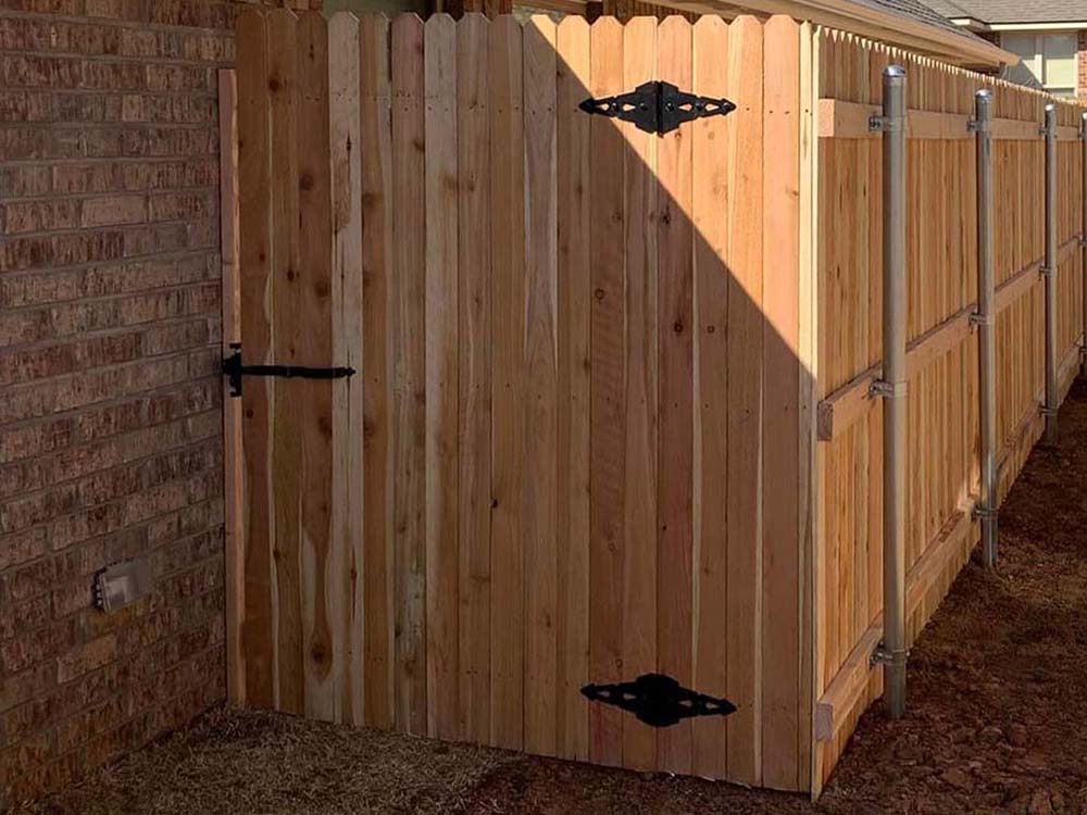 This Town OK stockade style wood fence